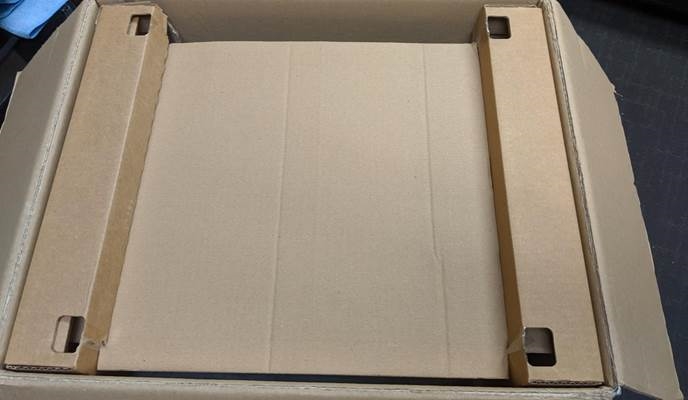 Colocaci&oacute;n de la cubierta antipolvo en la caja - Paso 2