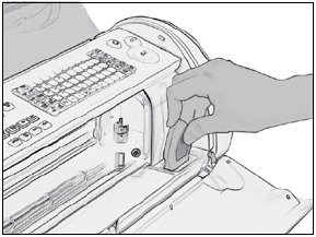 Inserte un cartucho Cricut en la ranura para cartuchos situada en la parte delantera de su m&aacute;quina Cricut Expression.